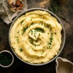 Chopped chives added on top of the plant-based mashed potatoes.