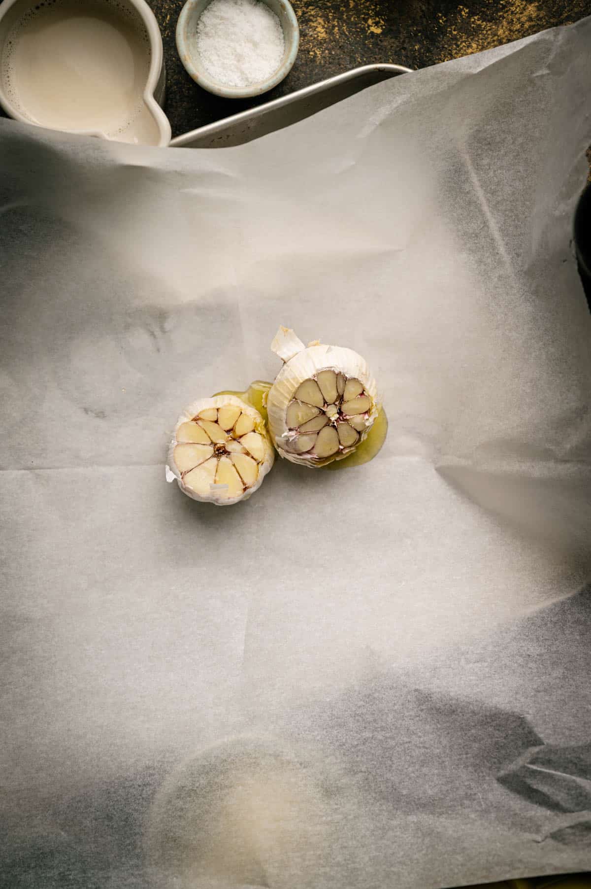 Roasting garlic in parchment paper.