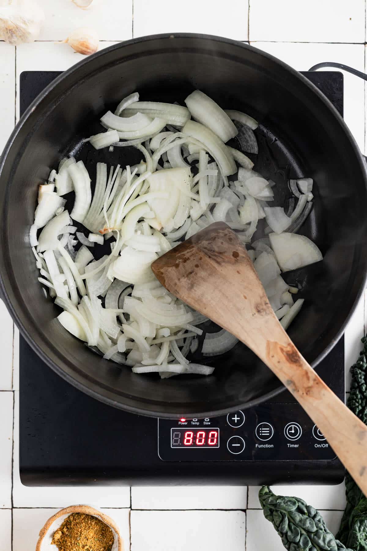 Slowly caramelizing onions over medium-low heat.