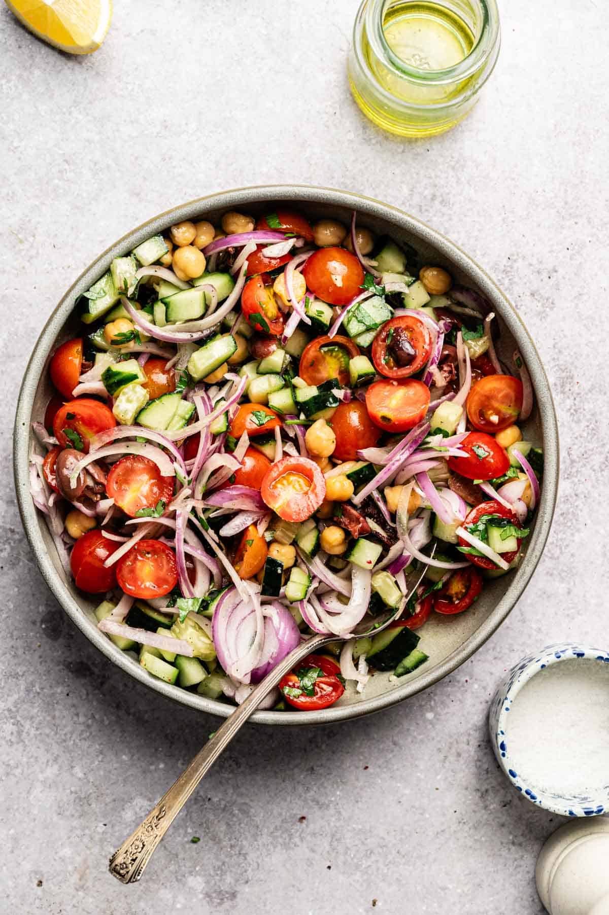Ingredients for loaded hummus dip being mixed together.